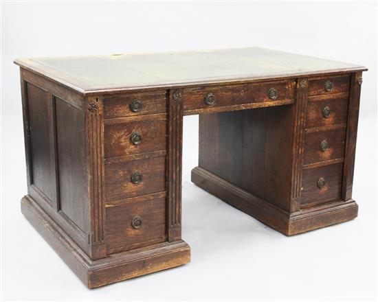 A late Victorian oak desk by Gillow, 3ft x 2ft 6in.